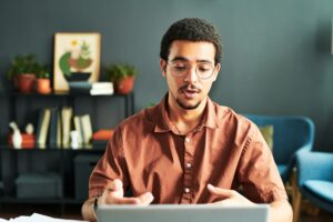 Young businessman or online student communicating with online audience