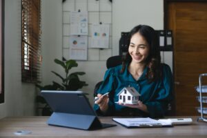 Young woman real estate advisor talking with client online about house sell or buy concept.